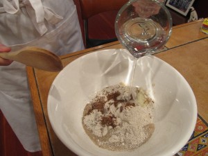 Starting the rye sour: water, rye flour, crushed rye seeds, grated onion